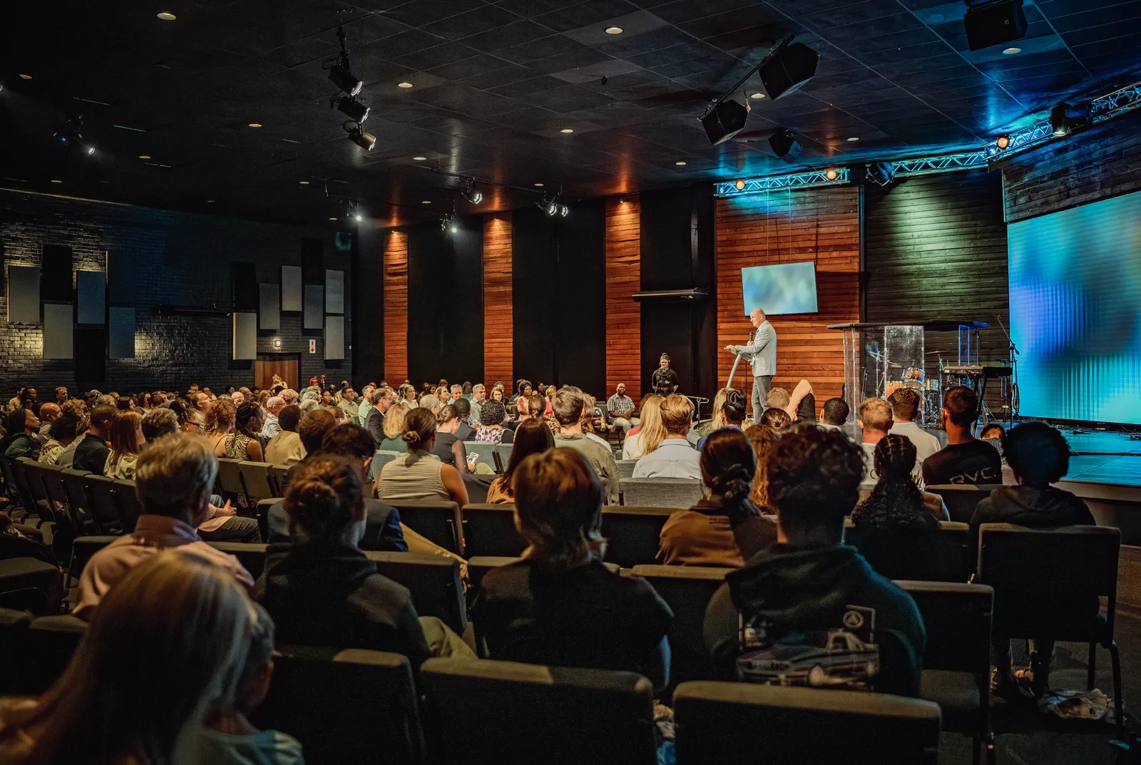 The Sons of Faith gathering, wide across the room