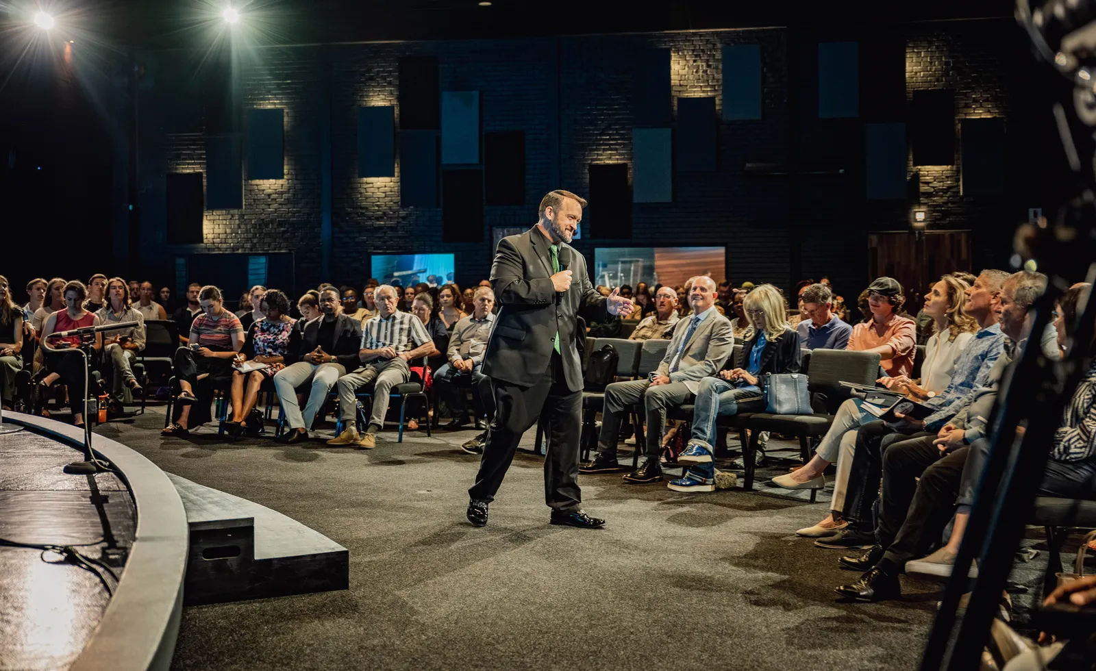 Ps Joshua Bulger preaching in the round