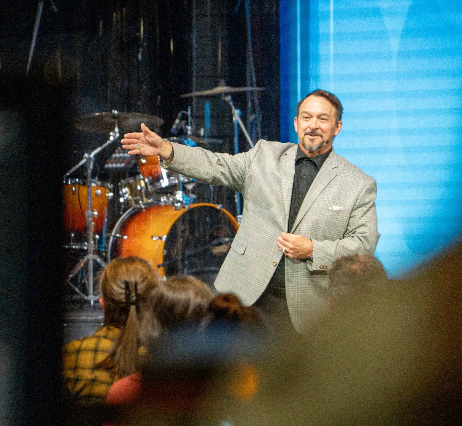 A minister preaching over the gathering